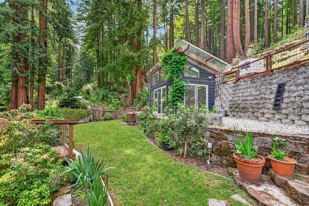 360 McGaffigan Mill Road Boulder Creek, CA 95006 - Photo 61 of 70 a view of a house with backyard and sitting area