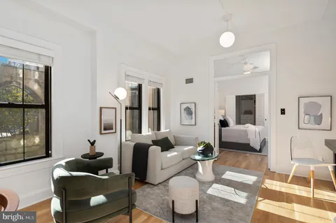 a living room with furniture and a table