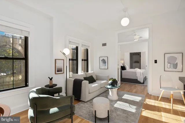 a living room with furniture and a table