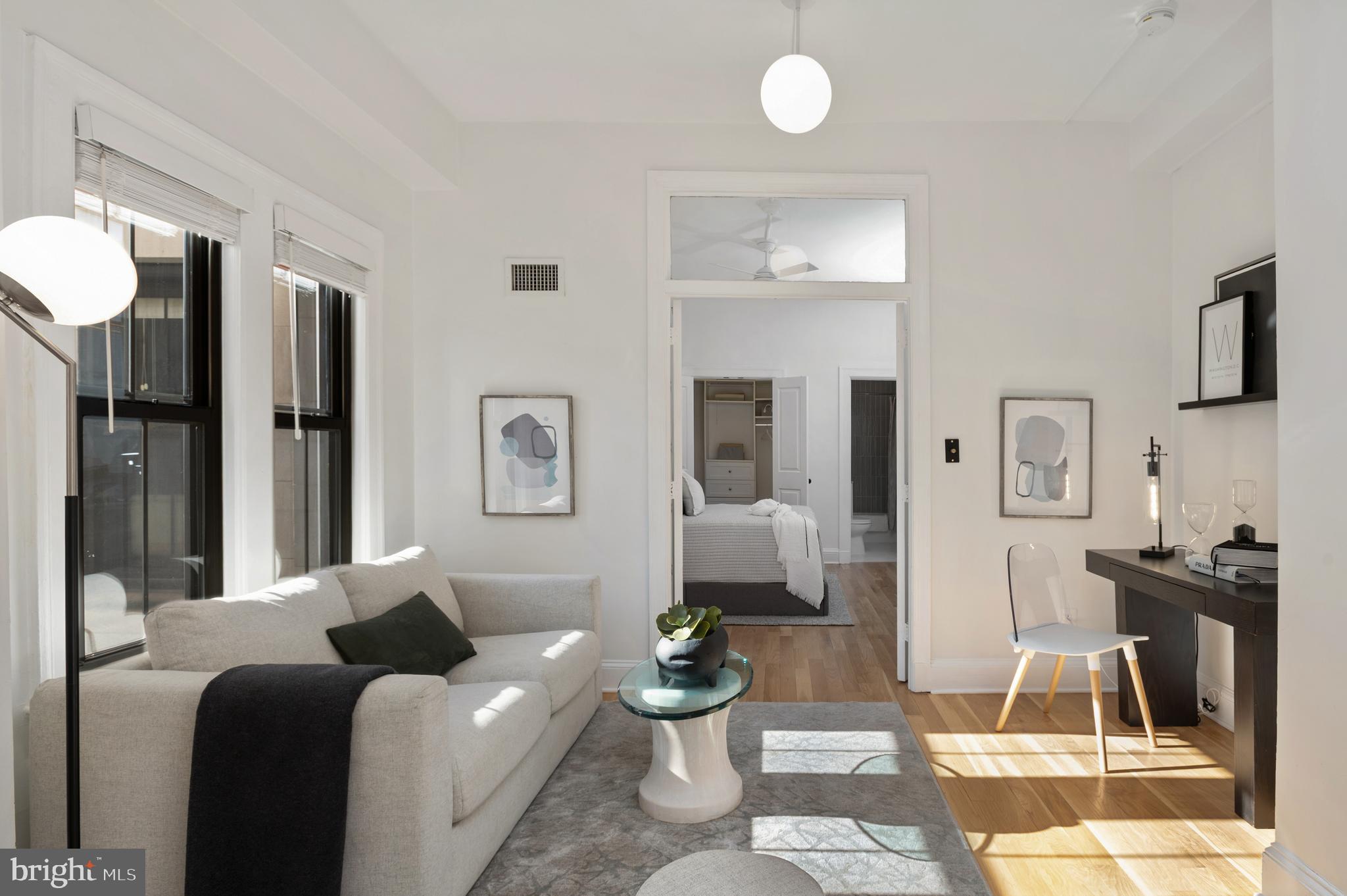 1613 Harvard Street Northwest, Unit 102 Washington, DC 20009 - Photo 14 of 27 a living room with furniture and a table