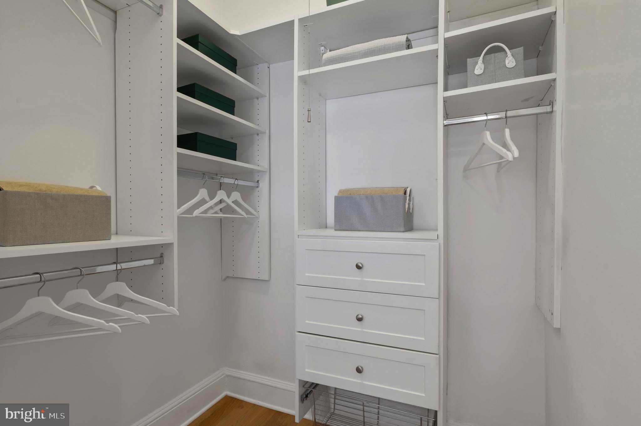 1613 Harvard Street Northwest, Unit 102 Washington, DC 20009 - Photo 20 of 27 a view of walk in closet with empty racks