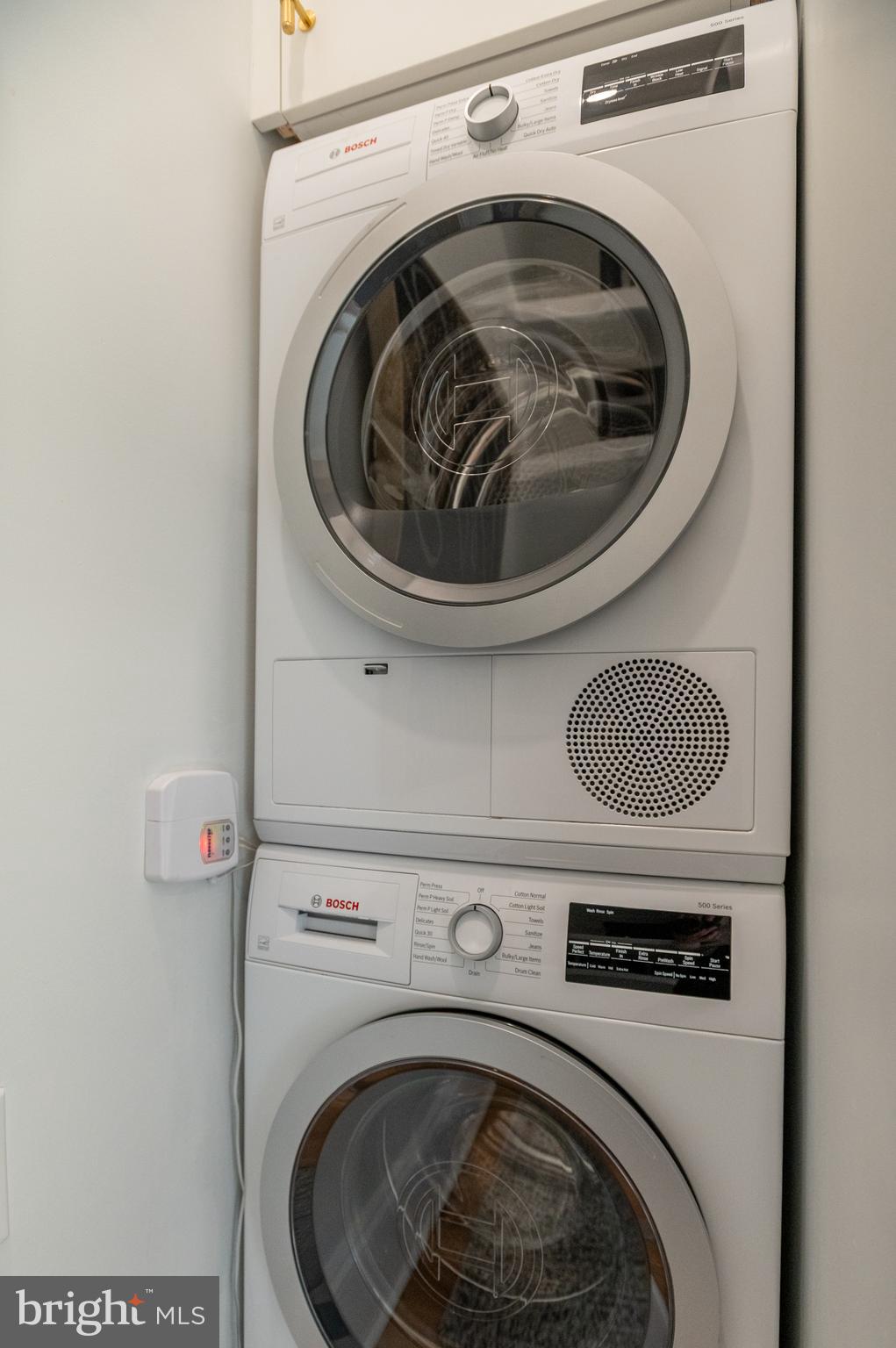 1613 Harvard Street Northwest, Unit 102 Washington, DC 20009 - Photo 23 of 27 a close up view of washer and dryer