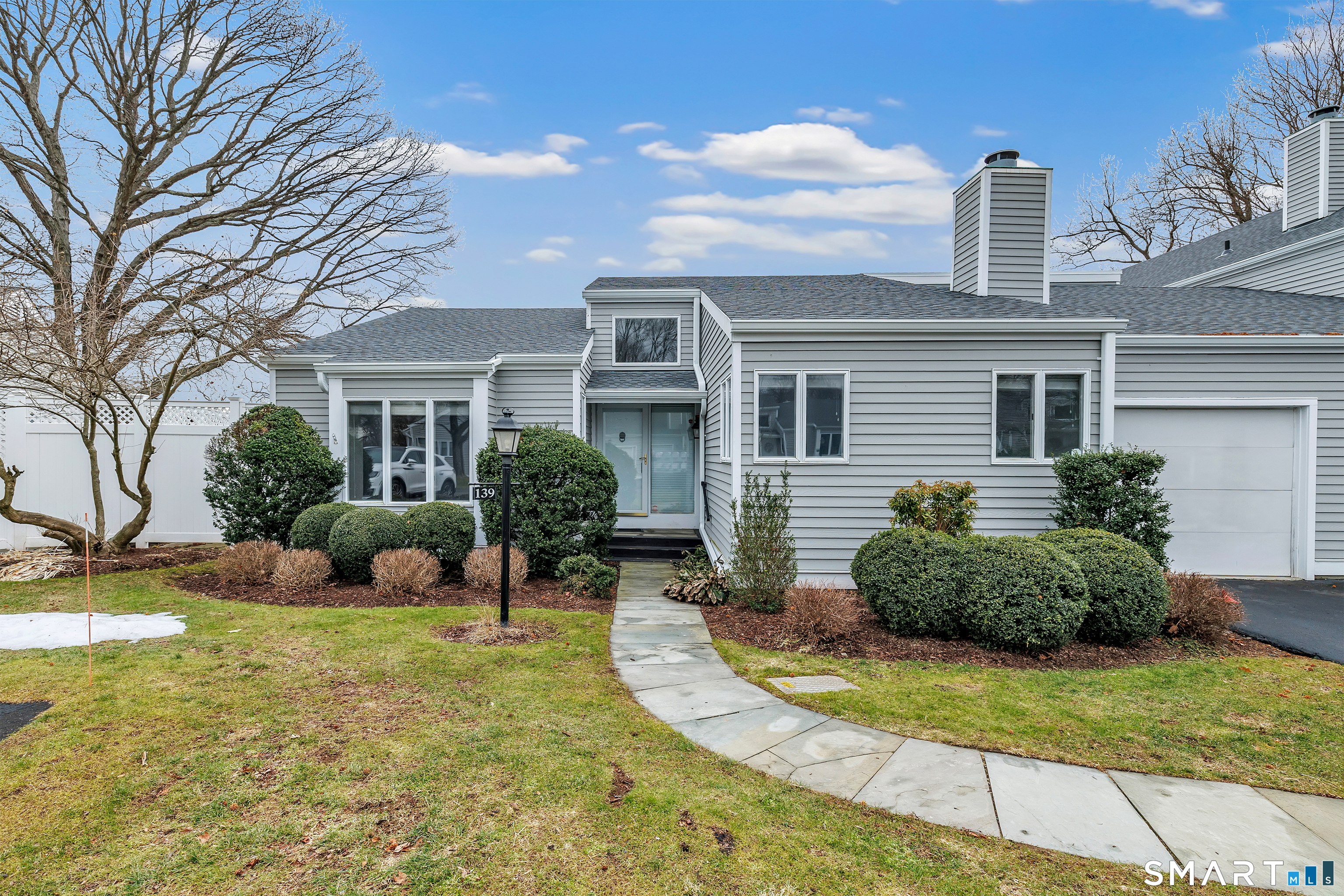 139 Field Point Drive, Unit 139 Fairfield, CT 06824 - Photo 1 of 34 front view of a house with a patio