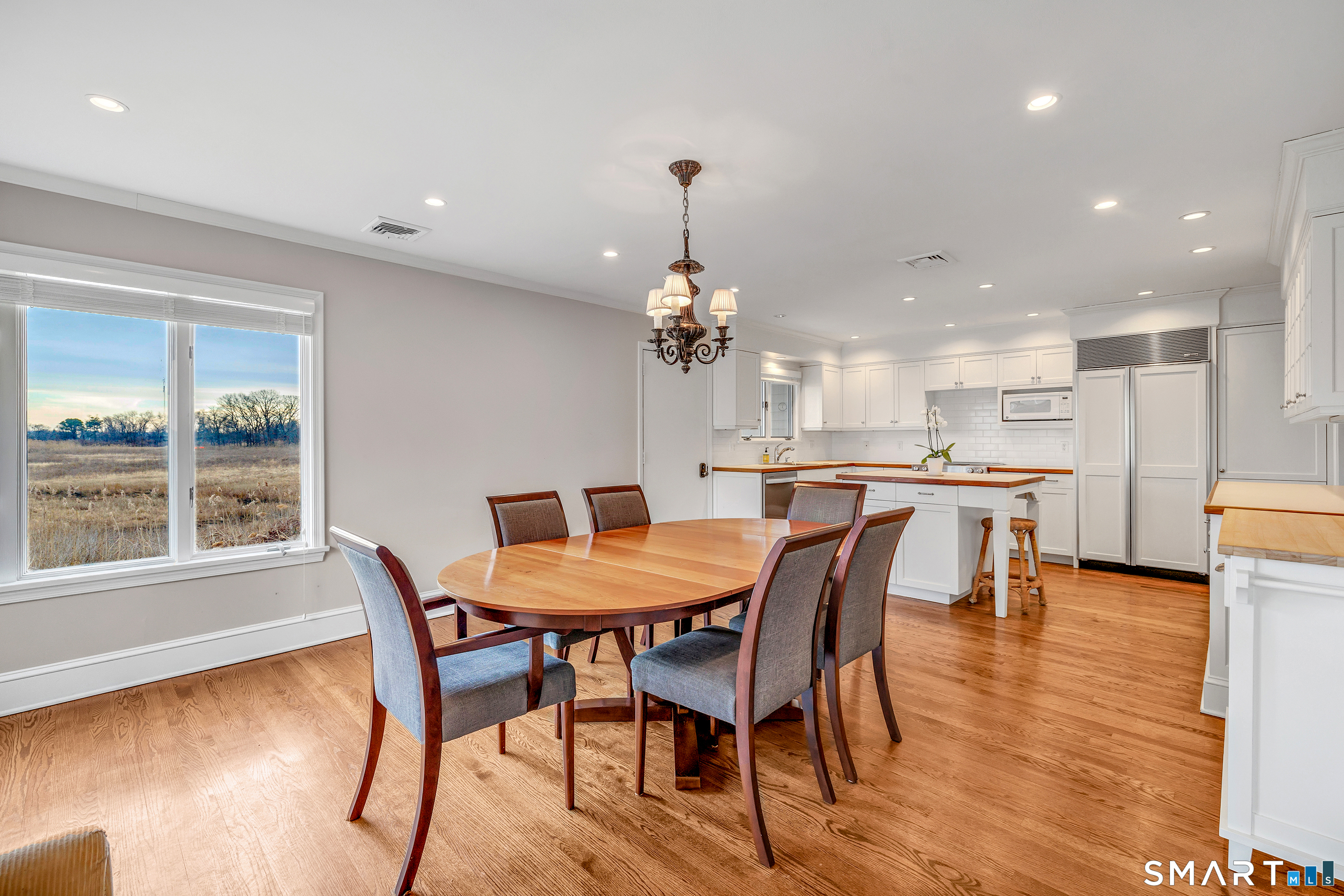 139 Field Point Drive, Unit 139 Fairfield, CT 06824 - Photo 12 of 34 a dining room with furniture and window