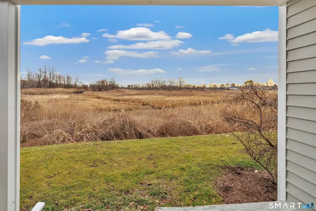 a living room with a couch and a fireplace