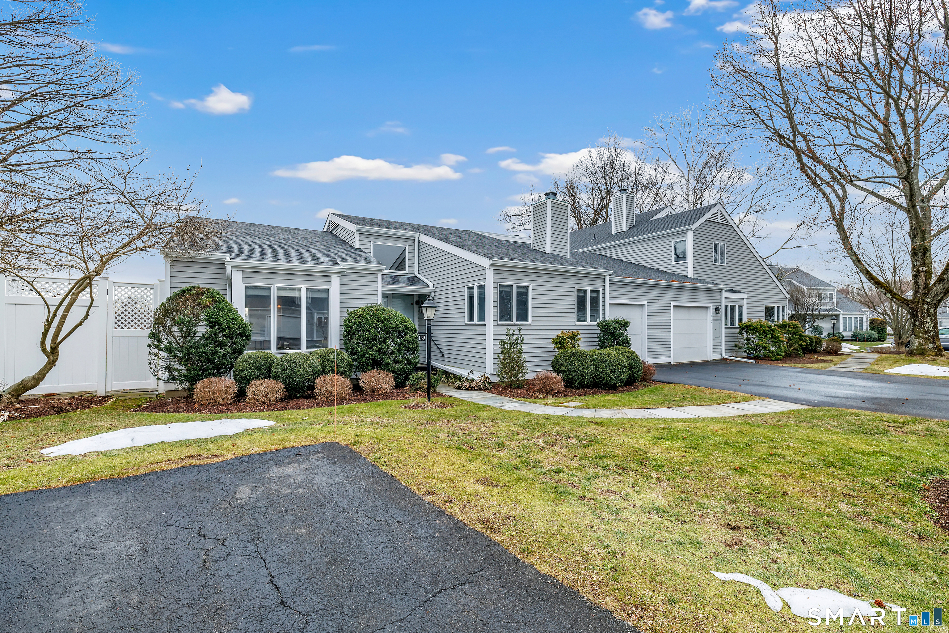 139 Field Point Drive, Unit 139 Fairfield, CT 06824 - Photo 32 of 34 a view of a house with swimming pool and a yard