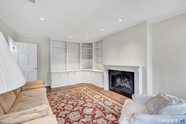 a living room with a couch and a fireplace
