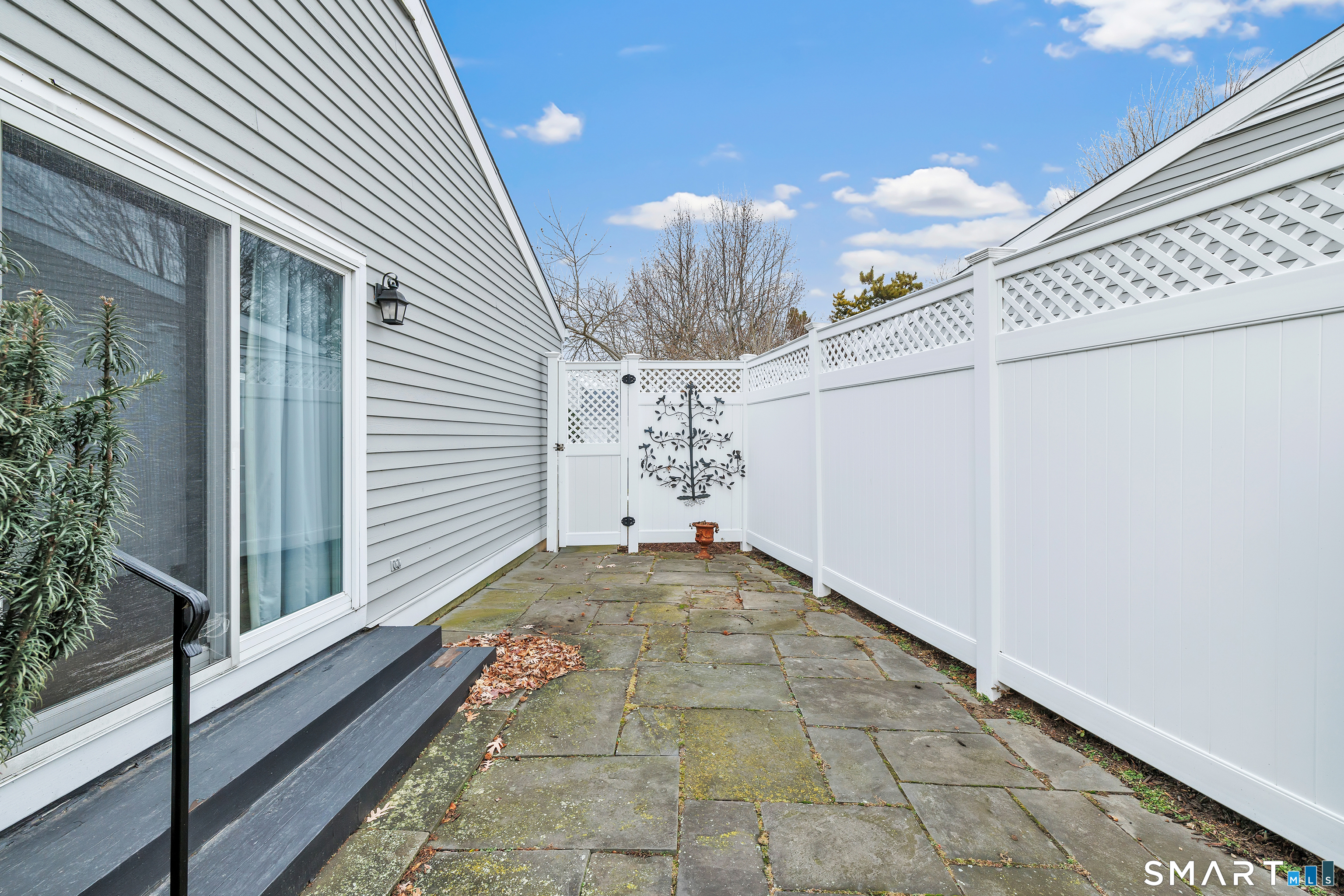 139 Field Point Drive, Unit 139 Fairfield, CT 06824 - Photo 10 of 34 a view of a house with a garage