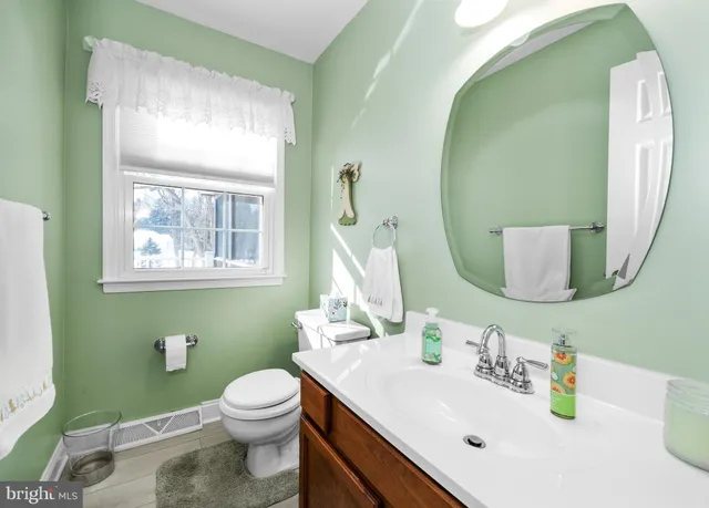 a view of a kitchen with stainless steel appliances granite countertop a stove and a microwave