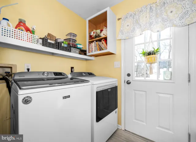 a bathroom with a sink and a window