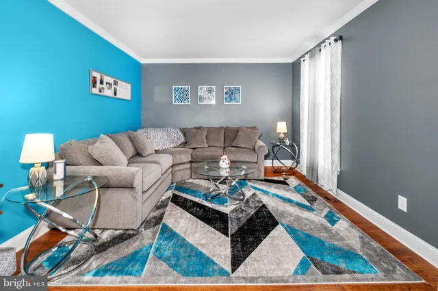 a living room with furniture and a rug