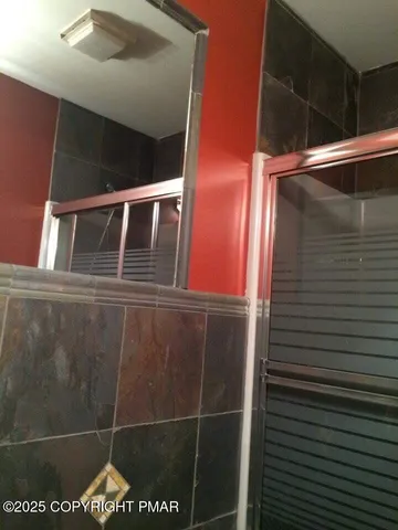a bathroom with a sink and mirror
