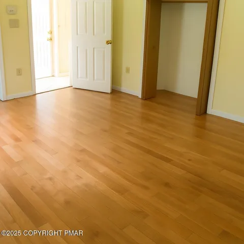 a bedroom with a bed and a night stand