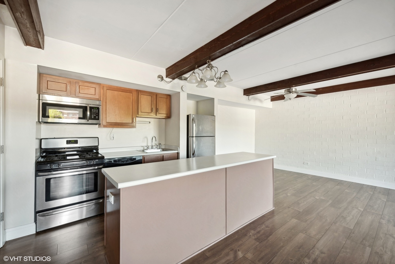 1605 Kenneth Circle, Unit 1605 Elgin, IL 60120 - Photo 2 of 12 a kitchen with stainless steel appliances a refrigerator and a stove