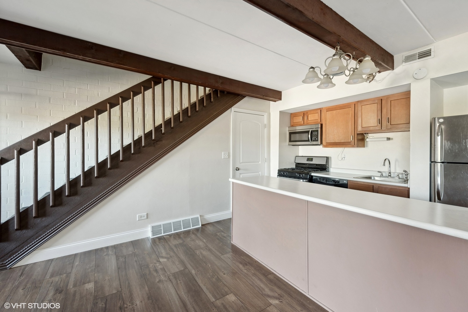 1605 Kenneth Circle, Unit 1605 Elgin, IL 60120 - Photo 4 of 12 a kitchen with stainless steel appliances a refrigerator and a stove top oven
