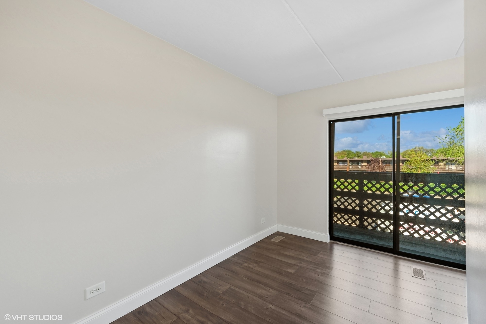 1605 Kenneth Circle, Unit 1605 Elgin, IL 60120 - Photo 8 of 12 a view of a room with wooden floor and large window