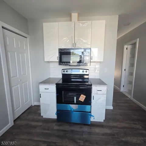 a kitchen with a stove and a microwave