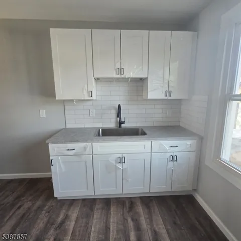 a view of a kitchen with cabinets