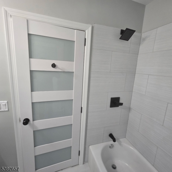 16 Baldwin Avenue, Unit 3 Newark, NJ 07108 - Photo 6 of 8 a bathroom with a tub