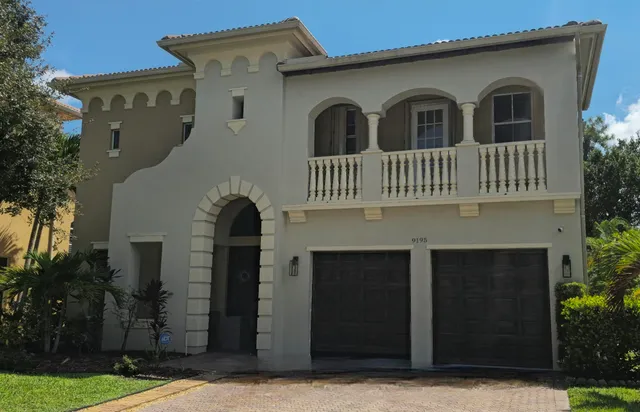 a front view of a house with yard