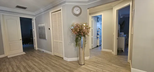 a bedroom with a bed a couch and dresser