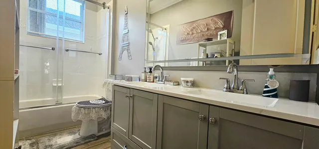 a bedroom with a bed and a mirror