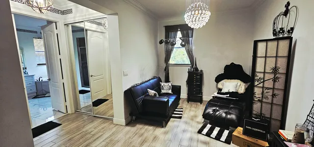 a spacious bathroom with a double vanity sink a toilet a mirror and shower