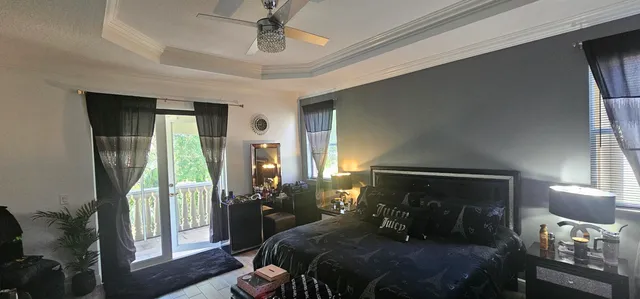 a bedroom with a bed a mirror and furniture