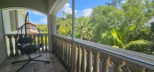 a view of a dining room with furniture and a window
