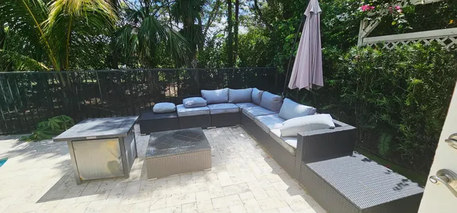 a view of a swimming pool with a patio