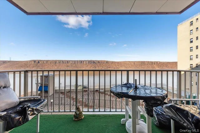 a view of a balcony with chairs