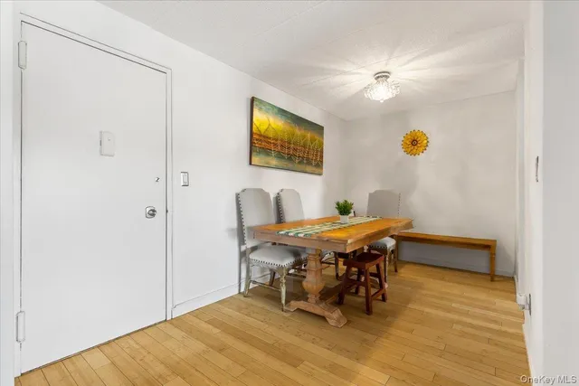 a dining room with a table and chairs
