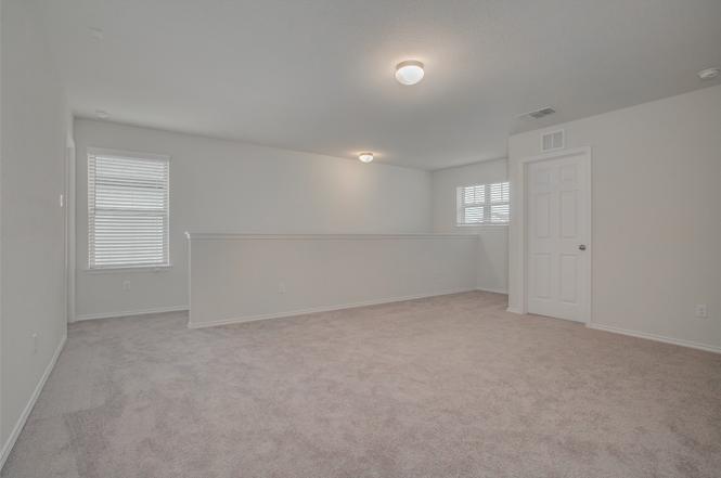 148 Spotted Rail Ridge Leander, TX 78641 - Photo 18 of 31 A spacious and adaptable loft area offers additional living flexibility.