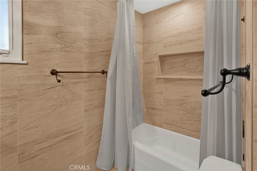15177 Mendota Road North Apple Valley, CA 92307 - Photo 25 of 50 a bathroom with a shower and a toilet