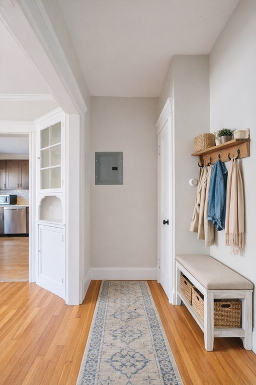 193 Florence Street, Unit 1 Boston, MA 02131 - Photo 6 of 16 a view of hallway with wooden floor and a rug