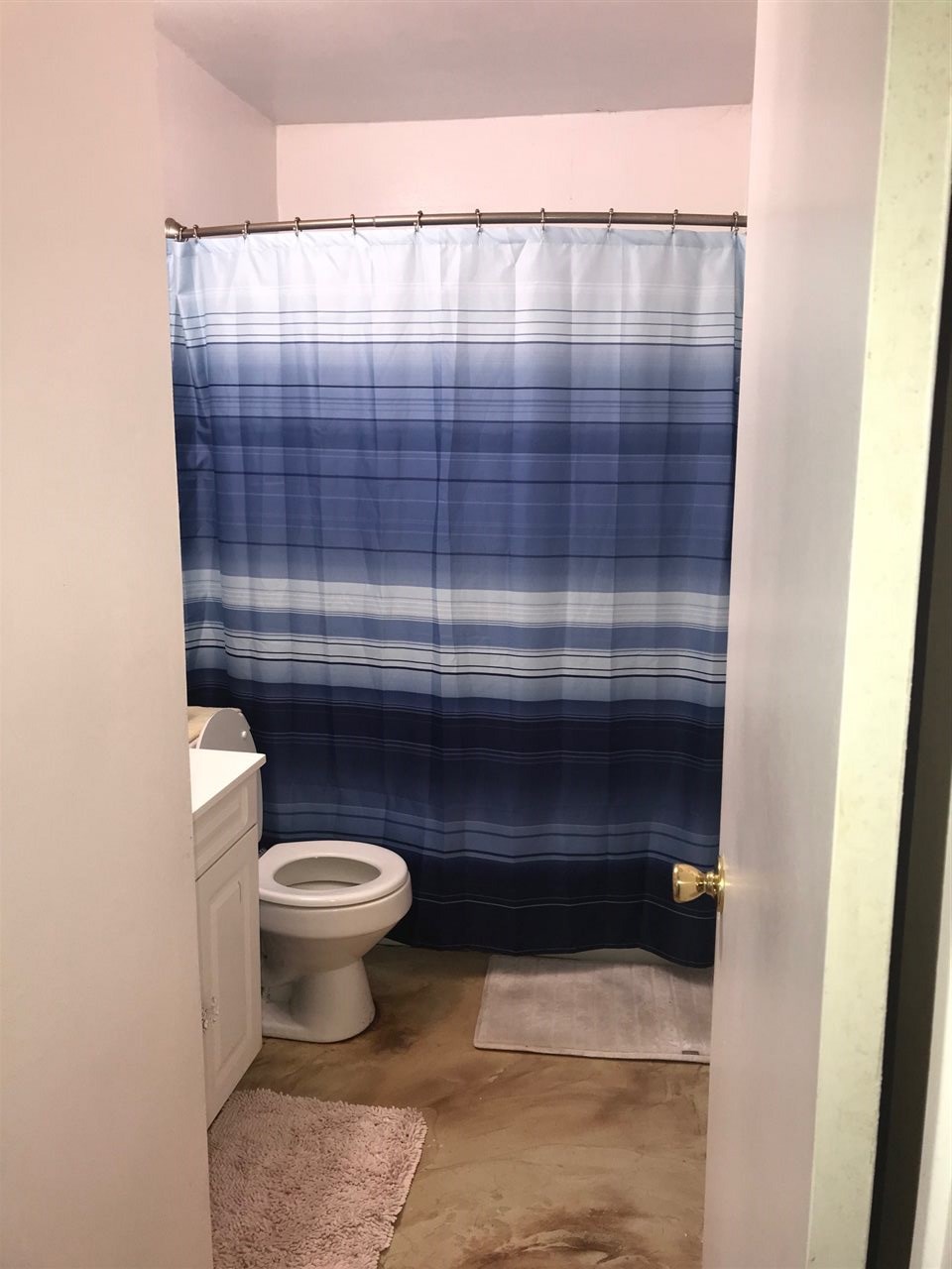 7502 Randy Road Machesney Park, IL 61115 - Photo 13 of 16 a bathroom with a toilet and a shower