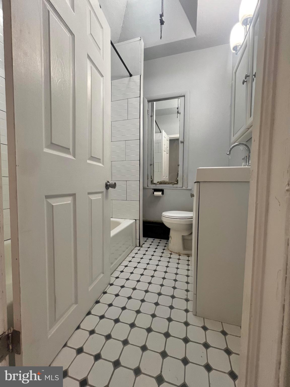 7321 Garman Street Philadelphia, PA 19153 - Photo 11 of 18 a bathroom with a sink a toilet and a shower