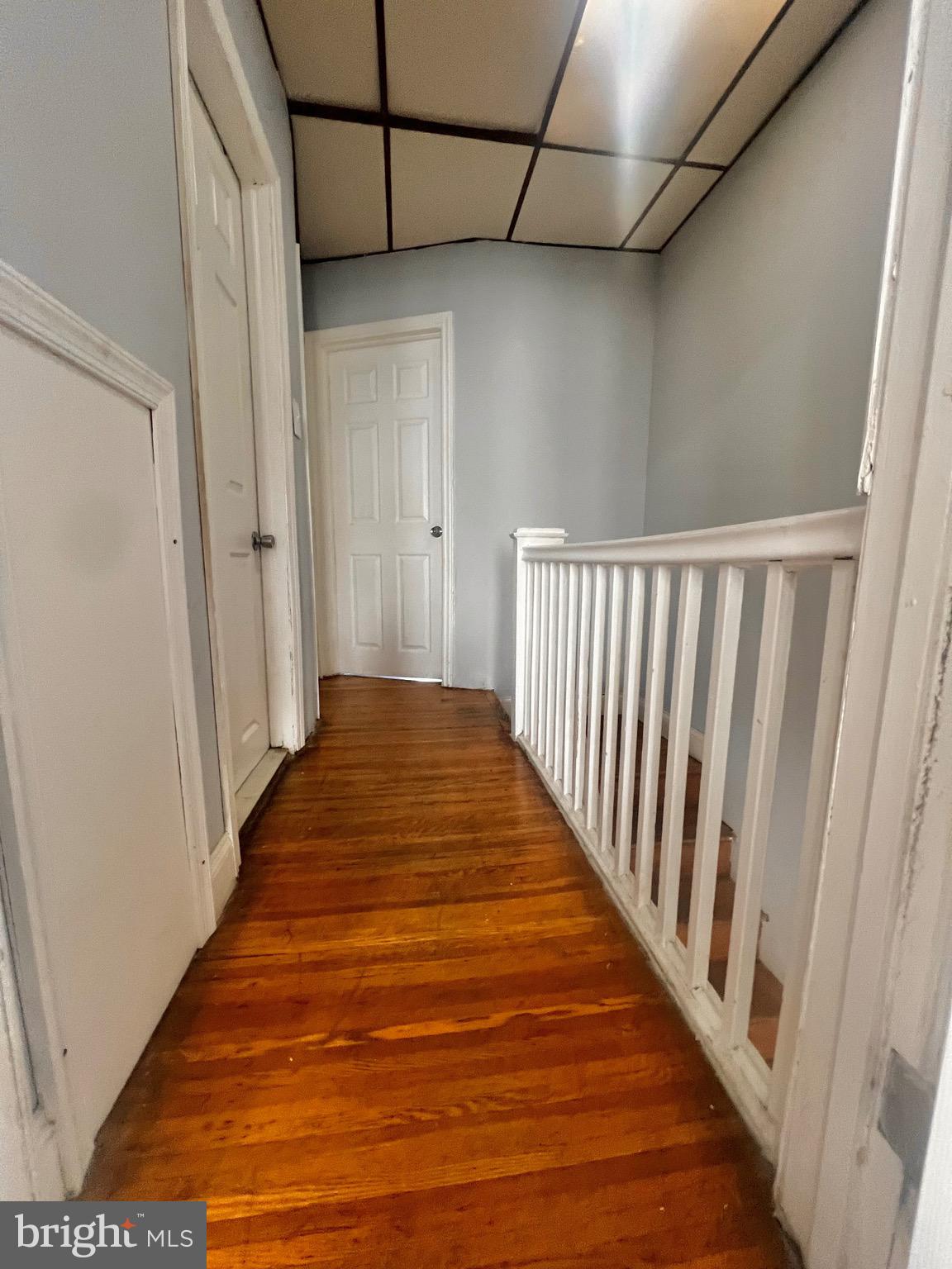 7321 Garman Street Philadelphia, PA 19153 - Photo 8 of 18 a view of a hallway with wooden floor