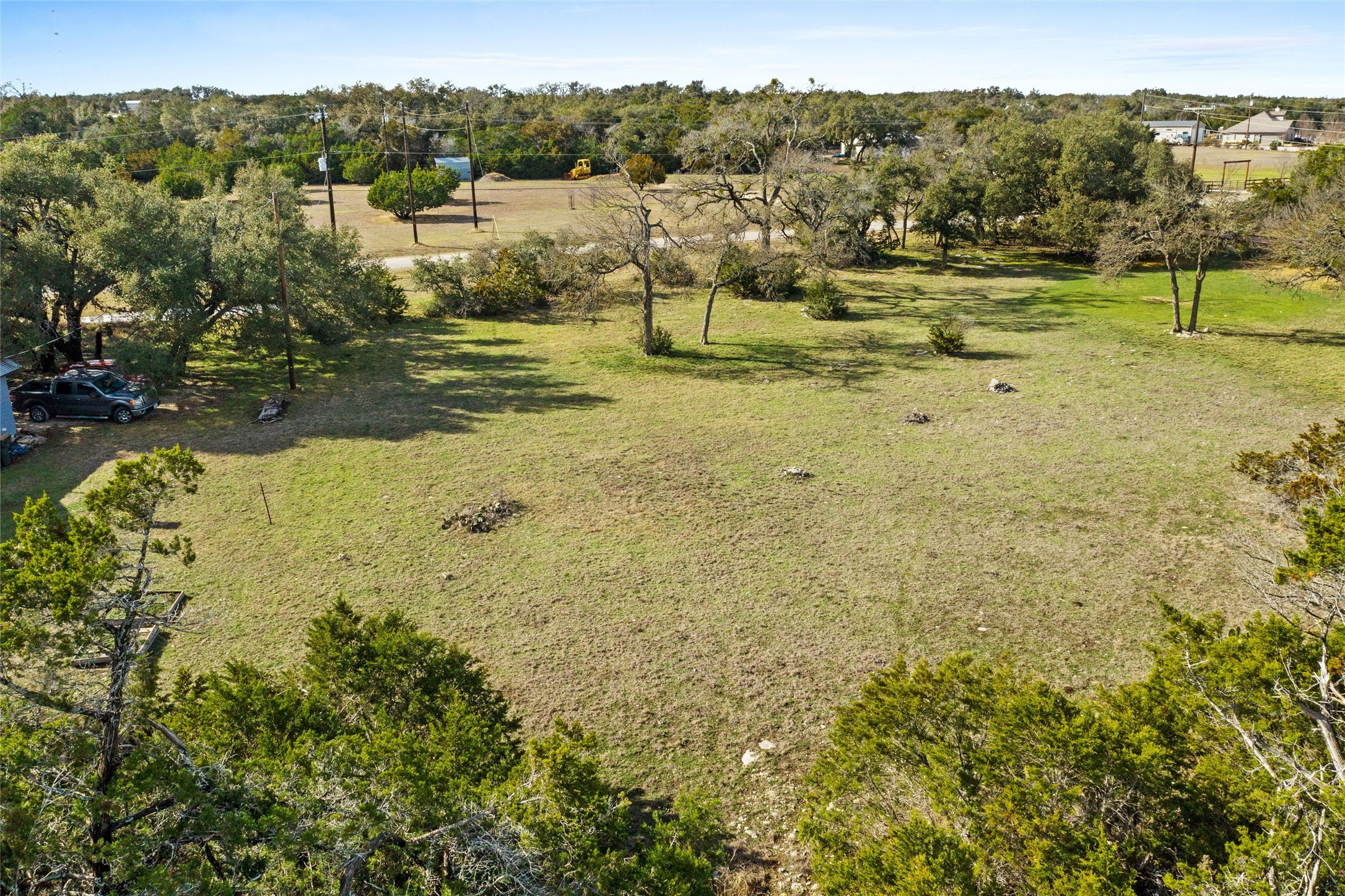 262 Beauchamp Road Dripping Springs, TX 78620 - Photo 4 of 10 a view of a lake with mountains in the background