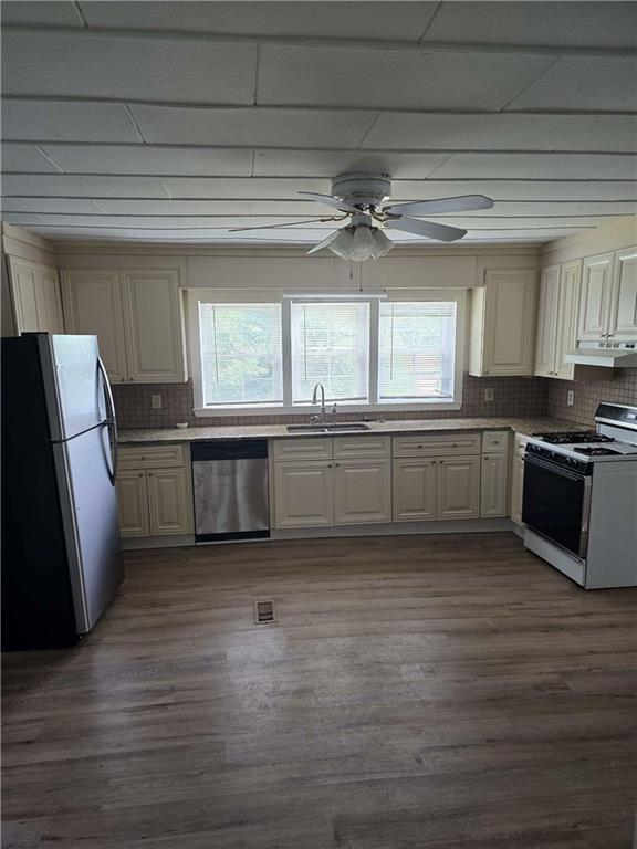 2863 Maysville Road Commerce, GA 30529 - Photo 7 of 15 a kitchen with granite countertop a refrigerator and a sink