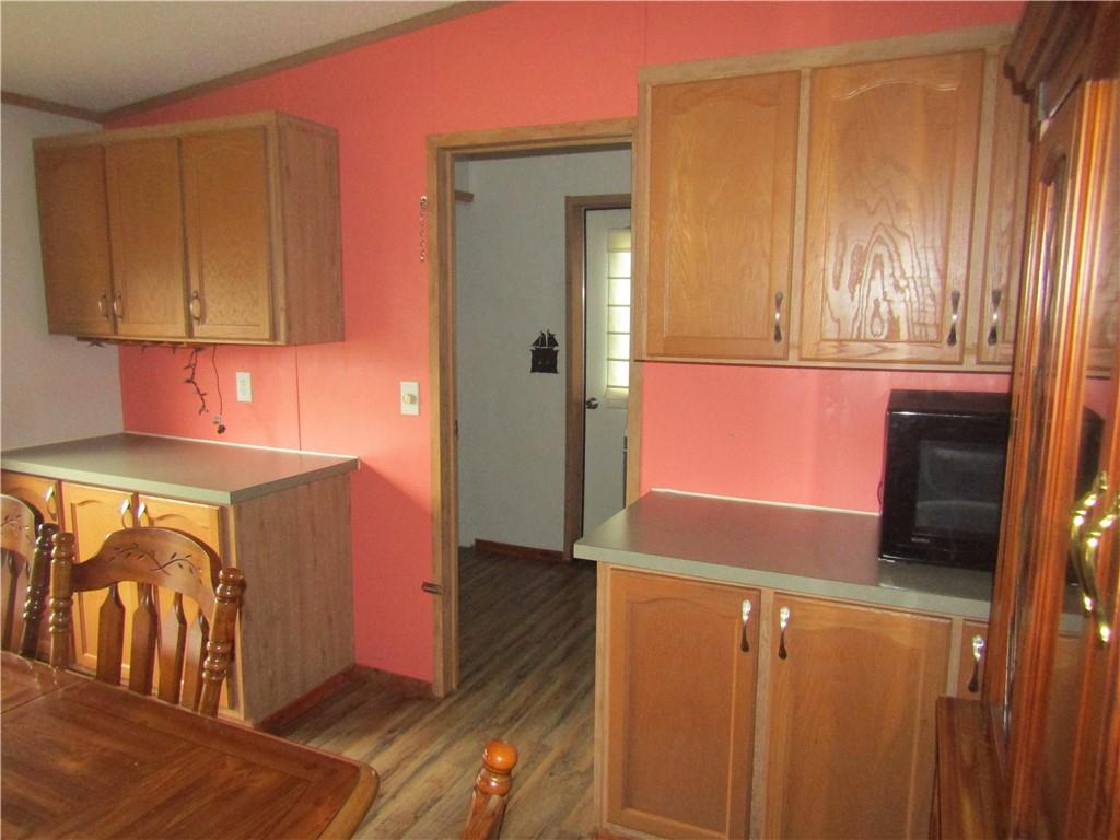 521 Williams Street Confluence, PA 15424 - Photo 7 of 38 a view of a kitchen with wooden floor and a sink