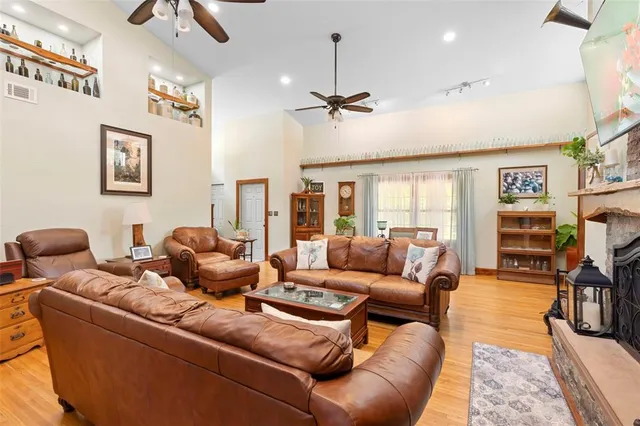 a dining room with furniture window and wooden floor