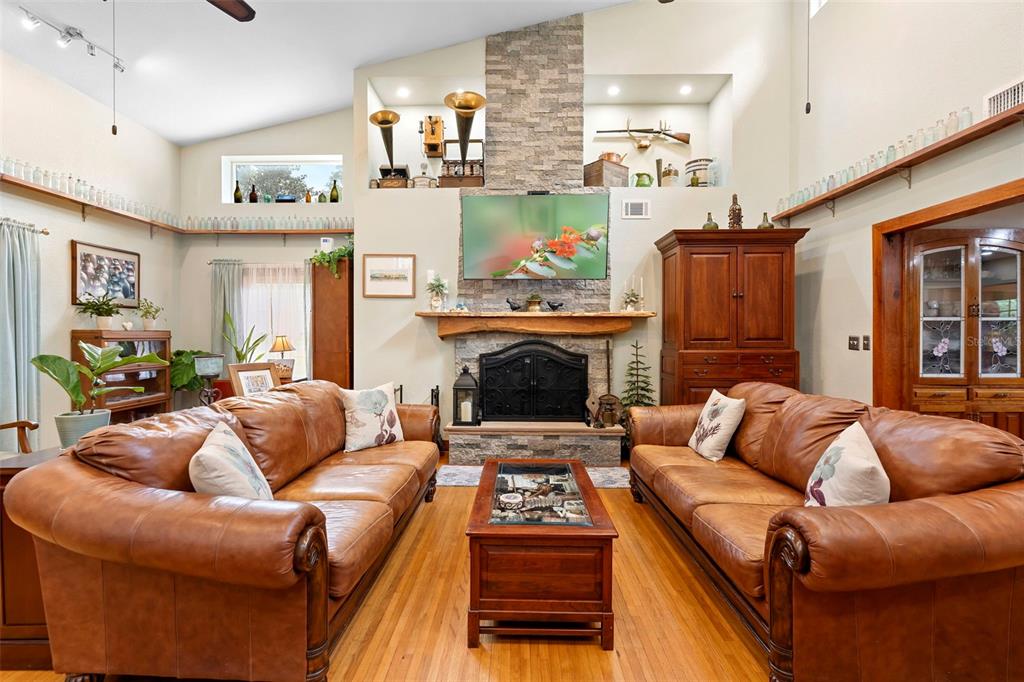 1056 Reynolds Road De Leon Springs, FL 32130 - Photo 12 of 74 a living room with furniture and a fireplace