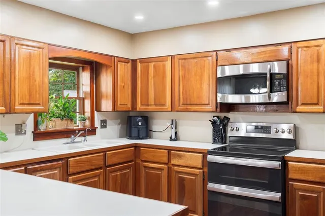 a bedroom with a large bed and a flat screen tv