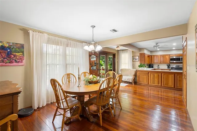 a bathroom with a granite countertop sink a mirror and a shower