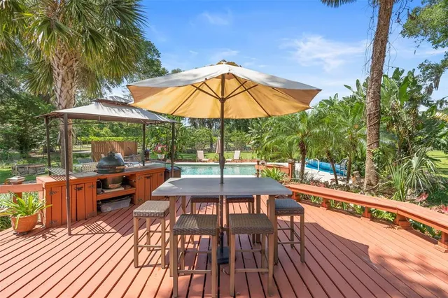 a bathroom with a double vanity sink mirror and shower