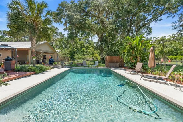 a bed room with a bed and a chandelier