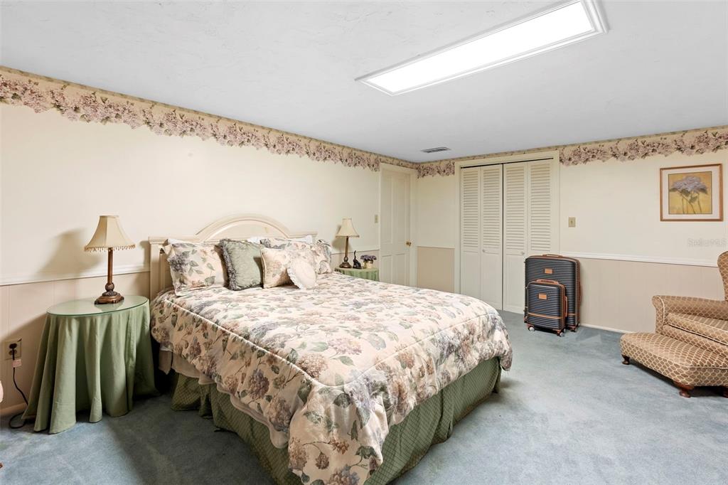 1056 Reynolds Road De Leon Springs, FL 32130 - Photo 39 of 74 a bedroom with a bed and a couch