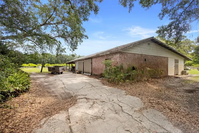 a view of a garage with a bike and car