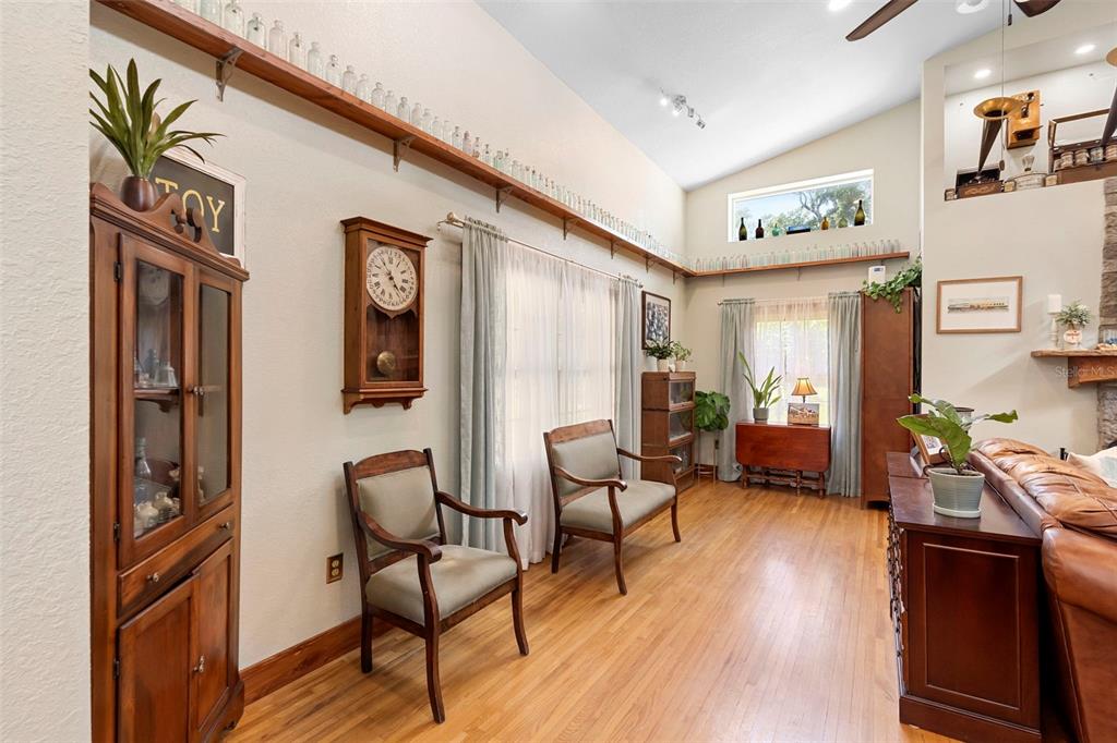 1056 Reynolds Road De Leon Springs, FL 32130 - Photo 10 of 74 a living room with furniture and wooden floor